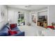 Spacious living room with sliding doors to screened patio at 20922 Jaffa Ln, Land O Lakes, FL 34637
