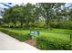 Community pet park with fenced-in area, benches, and shaded areas at 20922 Jaffa Ln, Land O Lakes, FL 34637