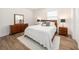 Bright bedroom with a king-size bed, dresser, and ample natural light at 211 W Broad St, Tampa, FL 33604