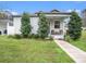 Cute bungalow with a front porch and landscaping at 211 W Broad St, Tampa, FL 33604