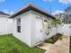 Detached shed with white exterior and a single door at 211 W Broad St, Tampa, FL 33604