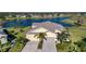 Property features a two-car garage and lakefront view at 2501 Sapphire Greens Ln, Sun City Center, FL 33573