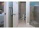 Small bathroom with toilet, shower, and neutral tile floors at 2501 Sapphire Greens Ln, Sun City Center, FL 33573