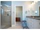 Bathroom boasts double vanity, walk-in shower, and large closet at 2501 Sapphire Greens Ln, Sun City Center, FL 33573