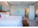 King-size bed in tranquil bedroom with ensuite access at 2501 Sapphire Greens Ln, Sun City Center, FL 33573