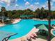 Relax by the large community pool with plenty of lounge chairs at 2501 Sapphire Greens Ln, Sun City Center, FL 33573