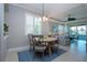 Casual dining area with a round table and seating for four at 2501 Sapphire Greens Ln, Sun City Center, FL 33573