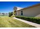 Well-manicured lawn and walkway leading to home entrance at 2501 Sapphire Greens Ln, Sun City Center, FL 33573