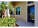 Inviting front entrance with a stylish blue door at 2501 Sapphire Greens Ln, Sun City Center, FL 33573