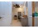 Bright home office features built-in shelving and a spacious work area at 2501 Sapphire Greens Ln, Sun City Center, FL 33573