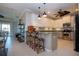 Modern kitchen with stainless steel appliances and an island at 2501 Sapphire Greens Ln, Sun City Center, FL 33573