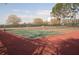 Two well-maintained tennis courts at 2501 Sapphire Greens Ln, Sun City Center, FL 33573