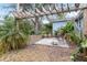 Cozy backyard patio with pergola and seating area at 2755 Morningside Dr, Clearwater, FL 33759