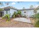 Small backyard patio with seating area and partial view of home at 2755 Morningside Dr, Clearwater, FL 33759