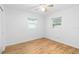 Bright bedroom with wood flooring and two windows at 2755 Morningside Dr, Clearwater, FL 33759