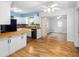 Eat-in kitchen with an open floor plan and wood flooring at 2755 Morningside Dr, Clearwater, FL 33759