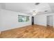 Bright living room with hardwood floors and a ceiling fan at 2755 Morningside Dr, Clearwater, FL 33759