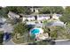 Aerial view of community with pool and townhouses at 3303 Brigadoon Dr, Clearwater, FL 33759
