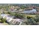 Aerial view of property showing location near lake and park at 3303 Brigadoon Dr, Clearwater, FL 33759
