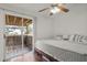 Main bedroom with sliding glass doors leading to a private deck at 3303 Brigadoon Dr, Clearwater, FL 33759