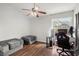 Bright bedroom with wood floors and workspace setup at 3303 Brigadoon Dr, Clearwater, FL 33759