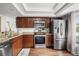 Modern kitchen with stainless steel appliances and granite countertops at 3303 Brigadoon Dr, Clearwater, FL 33759