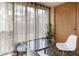 Relaxing sunroom with glass walls, offering natural light and outdoor access at 3303 Brigadoon Dr, Clearwater, FL 33759