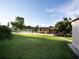 Large backyard with a covered patio and shed at 3916 W Oklahoma Ave, Tampa, FL 33616