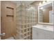 Clean bathroom with a glass block shower and vanity at 3916 W Oklahoma Ave, Tampa, FL 33616