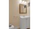 Small bathroom with white vanity, toilet and mirror at 3916 W Oklahoma Ave, Tampa, FL 33616