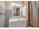 Clean bathroom with white vanity and a shower/tub combo at 3916 W Oklahoma Ave, Tampa, FL 33616