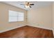 Spacious bedroom with hardwood floors and ceiling fan at 3916 W Oklahoma Ave, Tampa, FL 33616
