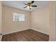Well-lit bedroom with hardwood floors and ceiling fan at 3916 W Oklahoma Ave, Tampa, FL 33616
