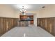 Dining area with wood wall accents and kitchen access at 3916 W Oklahoma Ave, Tampa, FL 33616