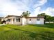 One-story house with a well-maintained lawn and carport at 3916 W Oklahoma Ave, Tampa, FL 33616