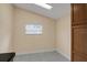 Laundry room with tile flooring and a window for ventilation at 3916 W Oklahoma Ave, Tampa, FL 33616