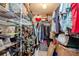 Large walk-in closet with shelving and hanging rods at 400 64Th Ave # 508, St Pete Beach, FL 33706