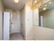 Hallway with built-in shelving and mirrored closet at 400 64Th Ave # 508, St Pete Beach, FL 33706