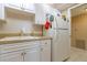 White kitchen with ample cabinetry and modern appliances at 400 64Th Ave # 508, St Pete Beach, FL 33706