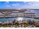 Aerial view of waterfront community with many homes and boats at 407 Boca Ciega Point N Blvd, St Petersburg, FL 33708