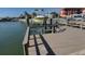 Private boat dock featuring a lift for convenient boat access at 407 Boca Ciega Point N Blvd, St Petersburg, FL 33708