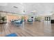 Spacious community room with tables, chairs, and a relaxing lounge area at 407 Boca Ciega Point N Blvd, St Petersburg, FL 33708