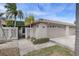 Residential building with double garage and walkway at 407 Boca Ciega Point N Blvd, St Petersburg, FL 33708