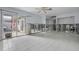 Spacious living room with tile floors and sliding glass doors leading to patio at 407 Boca Ciega Point N Blvd, St Petersburg, FL 33708