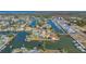 Wide aerial view of property and surrounding waterfront community at 4104 Flamingo Blvd, Hernando Beach, FL 34607