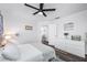 Bedroom with full bed, dresser and access to hallway at 525 Appaloosa Rd, Tarpon Springs, FL 34688