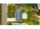 Top-down view of single Gathering home, showing roofline, yard, and driveway at 608 Florida Blvd, Crystal Beach, FL 34681