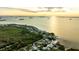 Aerial view of waterfront homes at sunset at 608 Florida Blvd, Crystal Beach, FL 34681