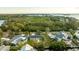Wide shot of waterfront property and neighborhood, showcasing homes and water views at 608 Florida Blvd, Crystal Beach, FL 34681