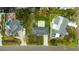 Overhead view of two homes and properties, including backyard patio and boat at 608 Florida Blvd, Crystal Beach, FL 34681